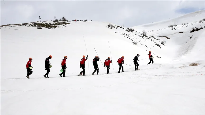 Rigorous training in the snow for a volunteer search and rescue team to respond to avalanches